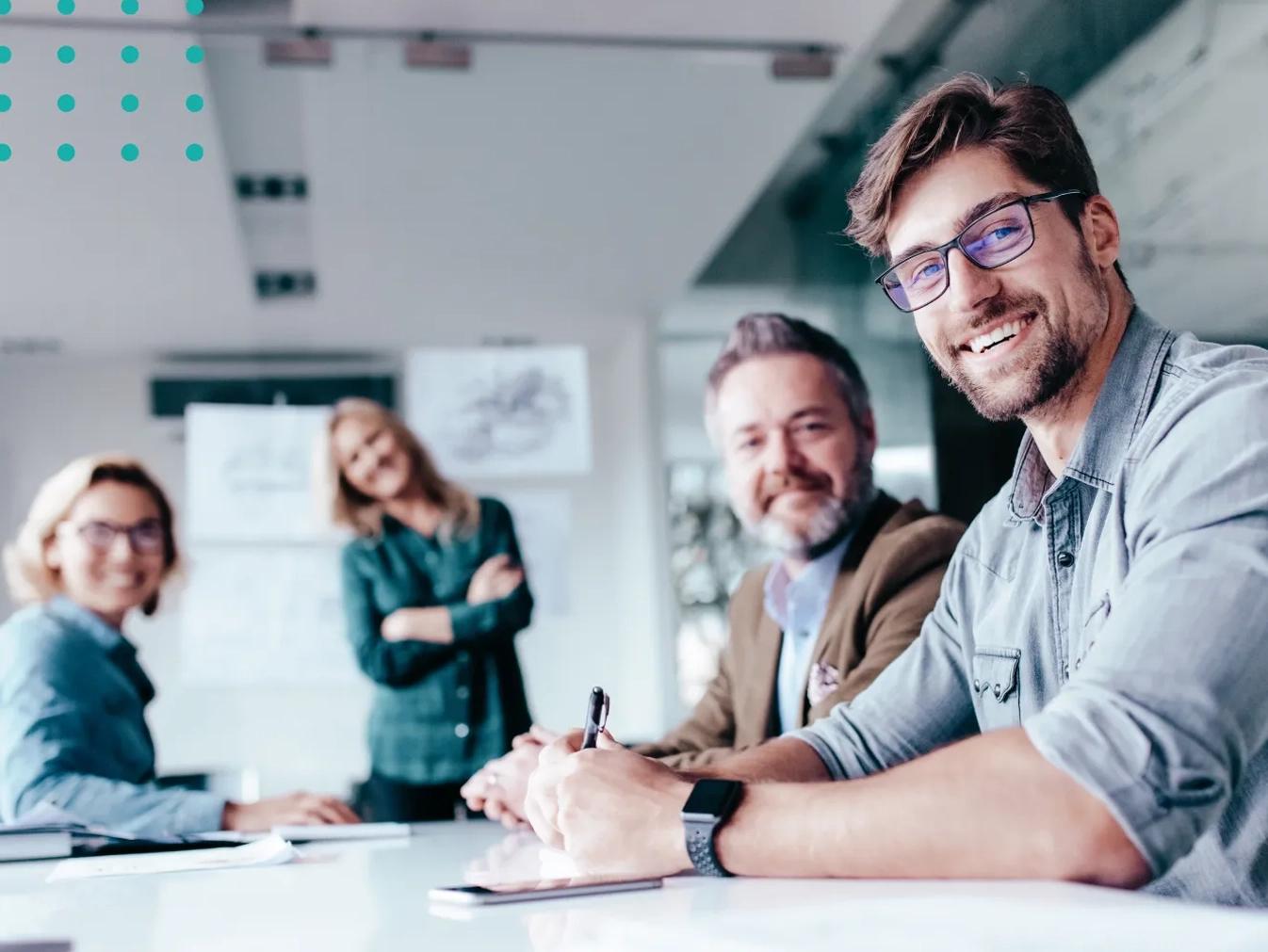team smiling while working on a project